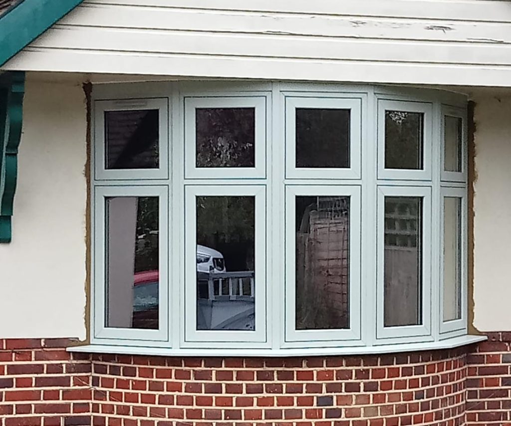 White bay windows for a Surrey home.